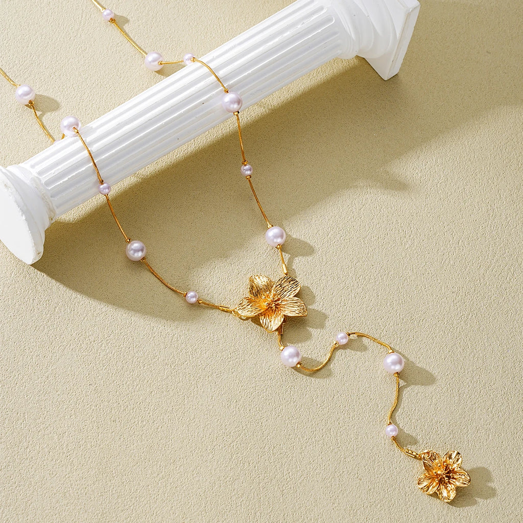 Women’s Long Pearl Tassel Necklace with Floral Pendant – Gold & White Jewelry