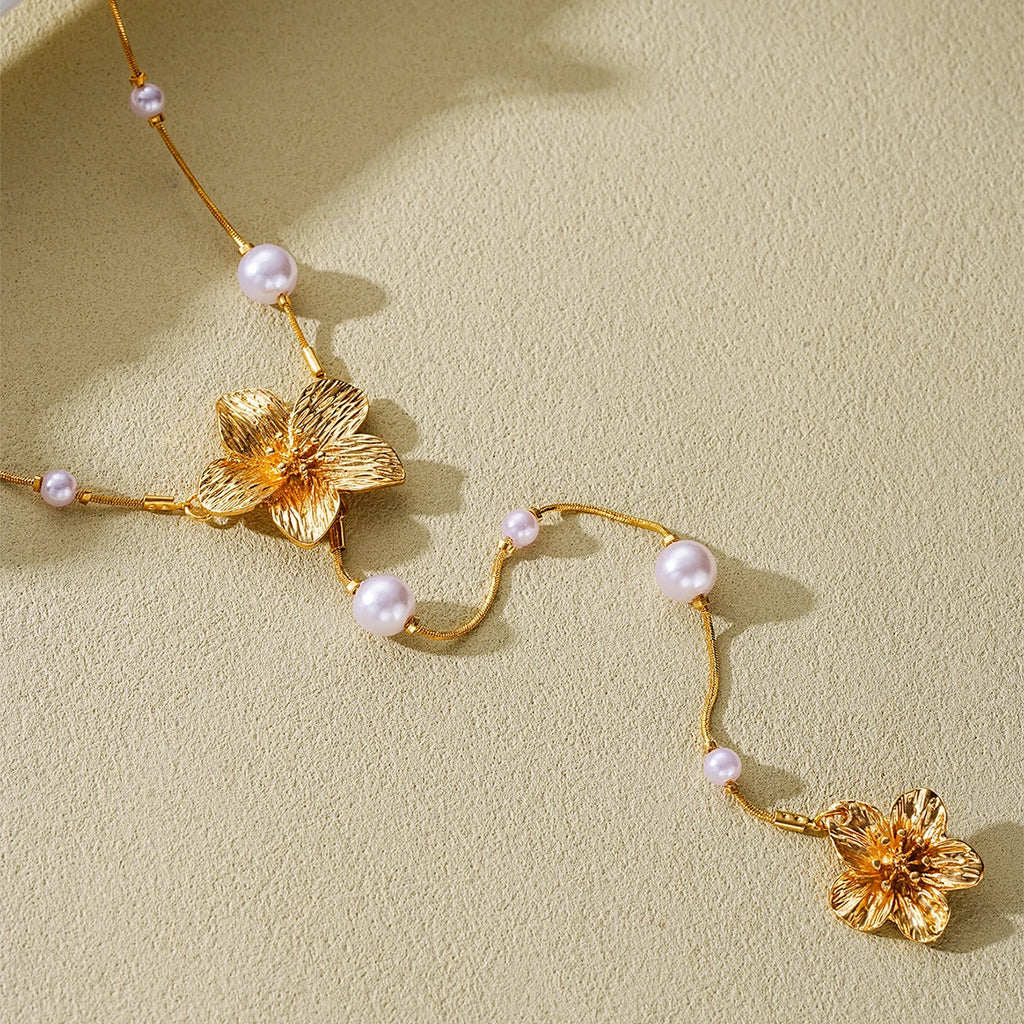 Women’s Long Pearl Tassel Necklace with Floral Pendant – Gold & White Jewelry