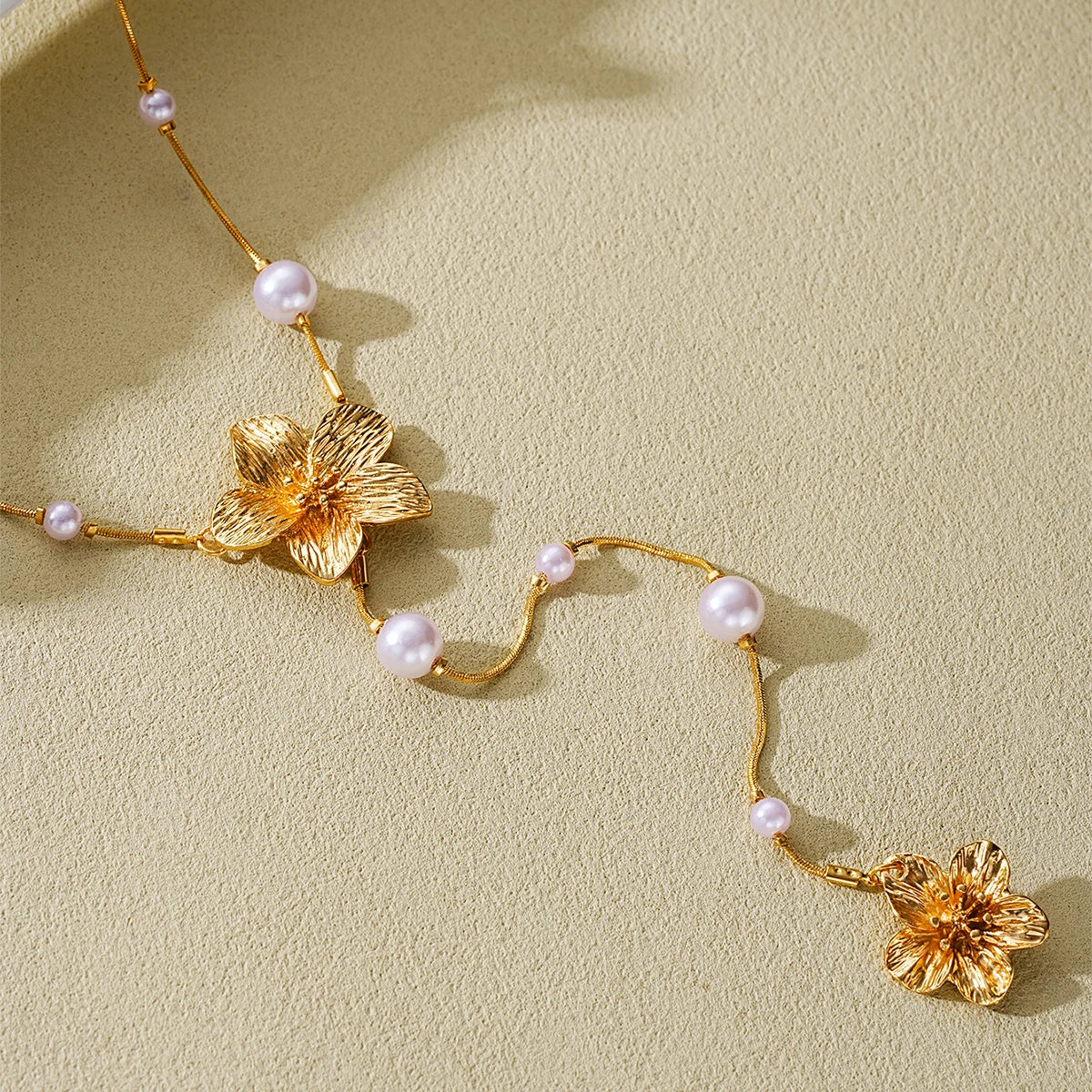Women’s Long Pearl Tassel Necklace with Floral Pendant – Gold & White Jewelry