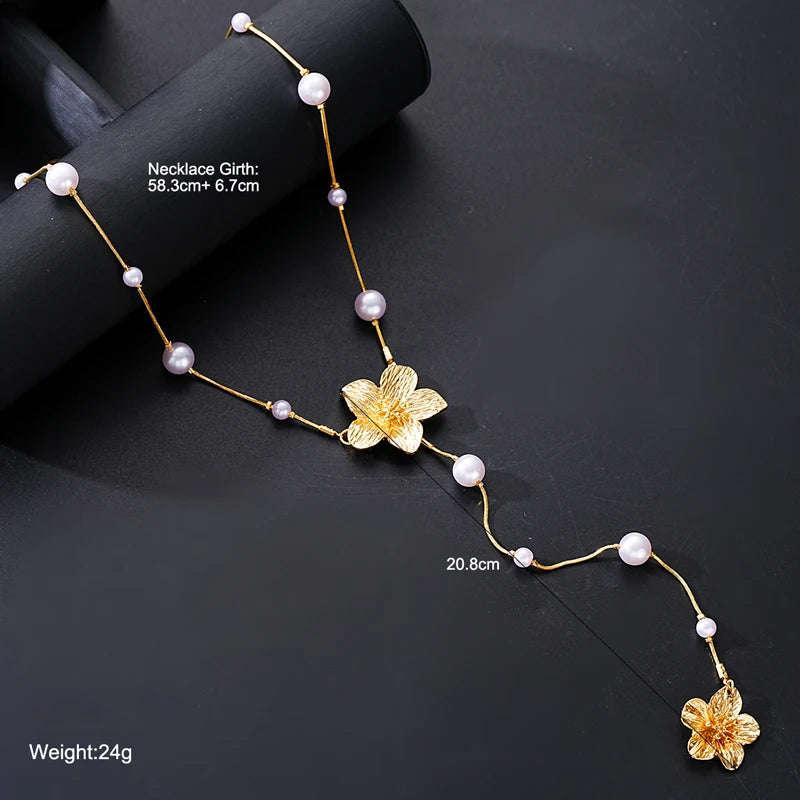 Women’s Long Pearl Tassel Necklace with Floral Pendant – Gold & White Jewelry