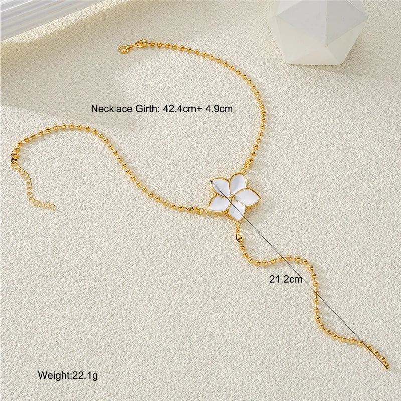 Women’s Long Pearl Tassel Necklace with Floral Pendant – Gold & White Jewelry